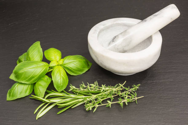 istock mortar and pestle with herbs 1174974240