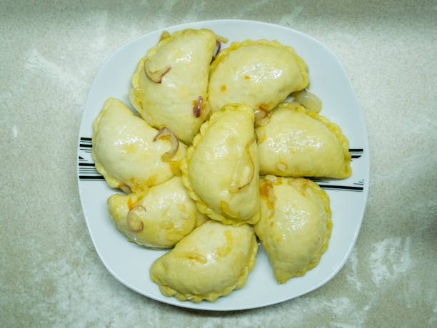 istock dumplings on in a white plate on a wooden table close up 1174976816