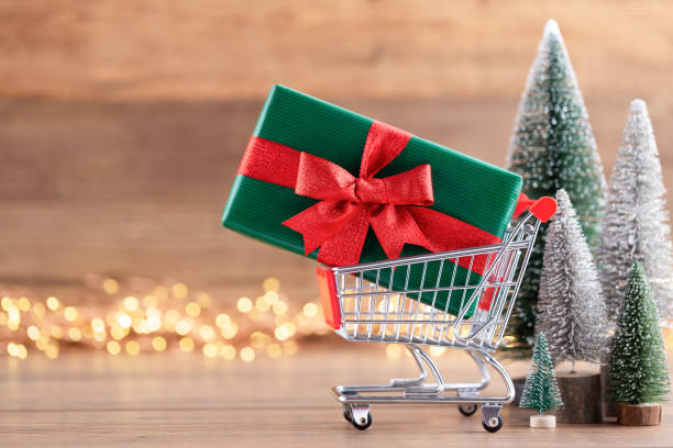 istock Colorful Christmas tree on wooden, bokeh background. 1174976907