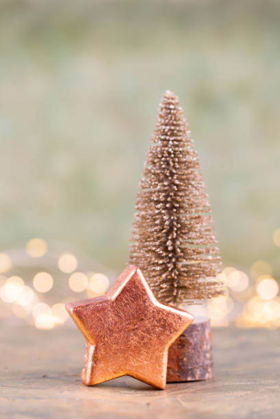istock Colorful Christmas tree on green, bokeh background. 1174977145