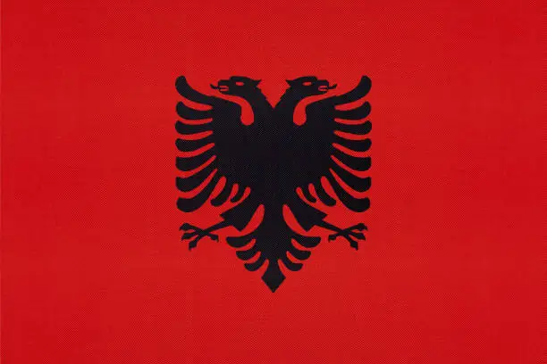 Albania national fabric flag textile background. Symbol of international world Balkan European country. State official Albanian sign.