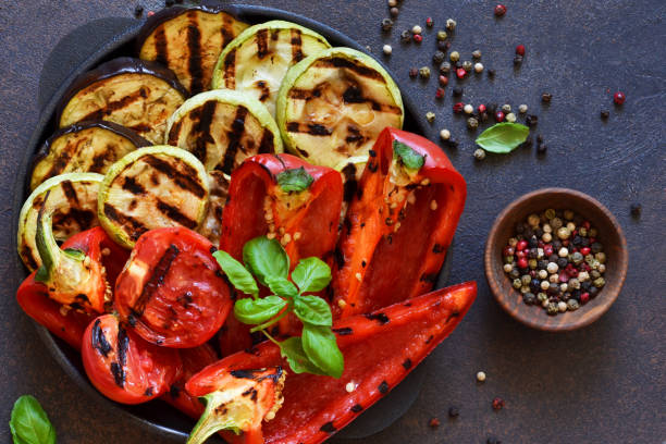 istock Frying pan with grilled vegetables on a stone background. View from above. Picnic. Barbecue. 1174979444