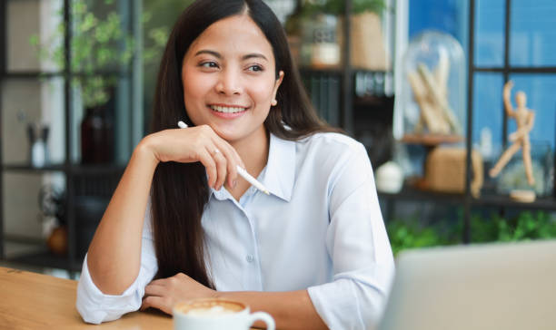 istock Asian woman in cafe 1174979472