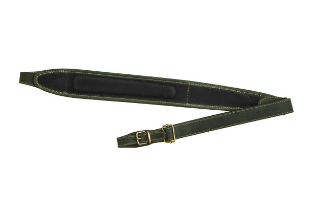 istock Green leather shoulder strap for a gun isolated on white background 1174981613