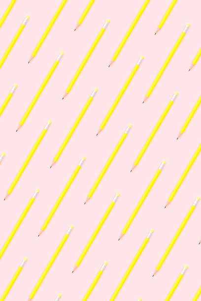 istock Yellow pencils flat lay on pink background 1174981634