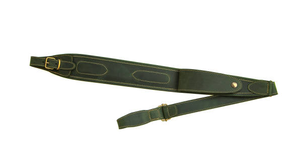 istock Green leather shoulder strap for a gun isolated on white background 1174981969