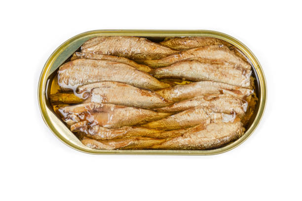 istock Top view of sprats in open tin can close-up 1174982675