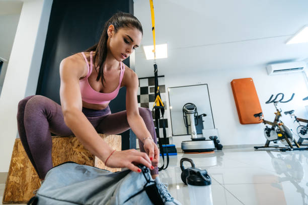 istock Woman opening gym bag 1174985144