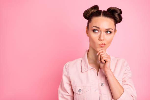 istock Portrait of pensive lady looking at copy space think choose decide solution touching her chin wearing jacket isolated over pink background 1174985242