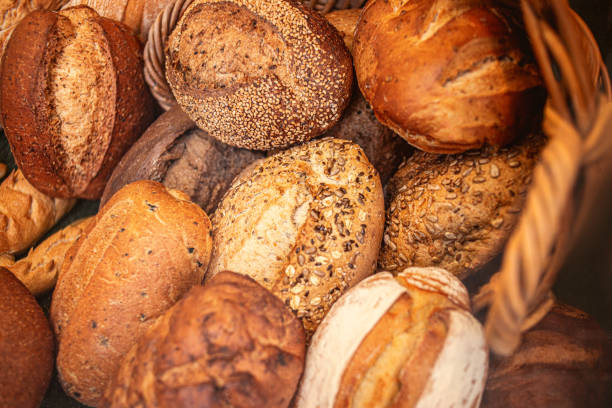 istock Different kinds of Freshly Baked  Bread, may use as background, top view.  Rustic loaves of bread close up. 1174986035