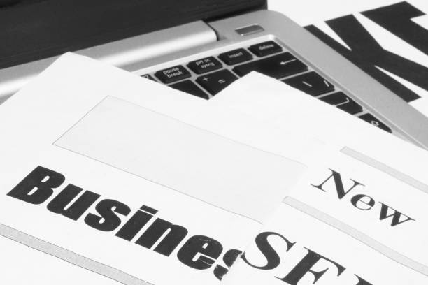 istock Newspapers and Laptop 1174986175