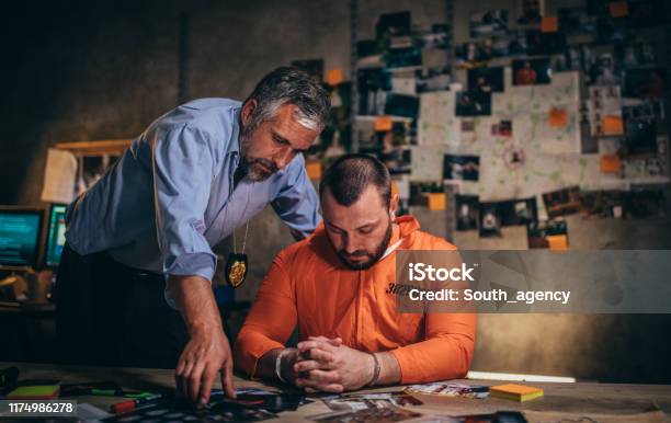 Detective Interrogating A Prisoner Stock Photo - Download Image Now - Adult, Arrest, Beard