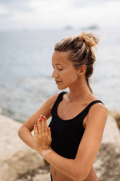 istock Yoga on the beach 1174986433