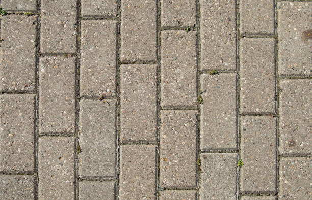 istock Background of stone walkway with leaves. Stone background 1174986949