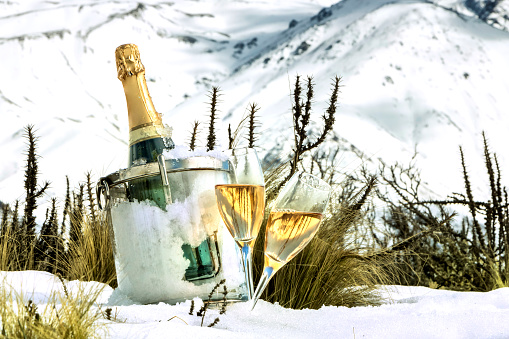 Fresh sparkling wine at the foot of the snowy mountain.