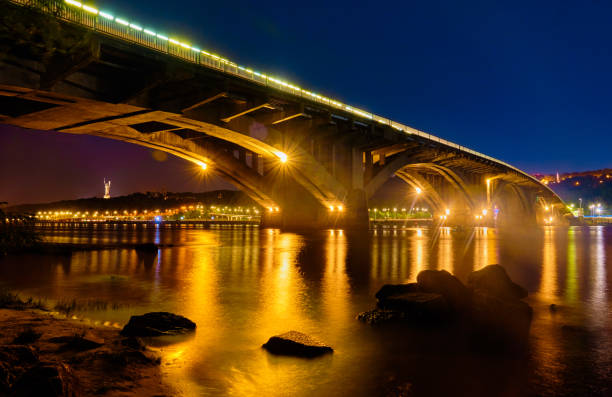istock Metro Bridge and  Dnieper River at night in Kyiv. 1174987797