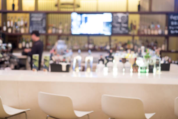 istock Blurred of pub bar counter with various spirits and beer at pub 1174987872