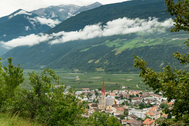 The city of Schlanders (South Tyrol, Italy) from above on a cloudy day in summer