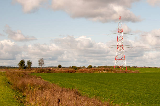 istock High-voltage electric main against the dark blue sky in summer day 1174989976