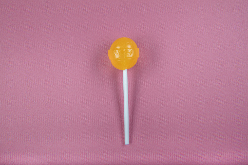Lollipop on pink background