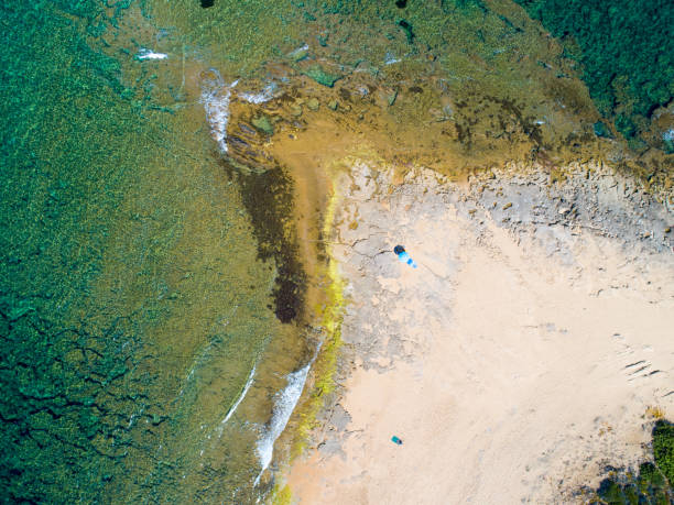 istock Rocky coast and waves in Sardinia from above 1174991291