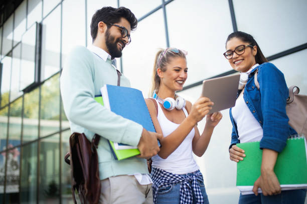 istock Happy group of friends studying and talking together at university 1174992536