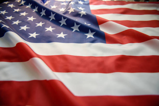 istock US American flag waving as background 1174996087