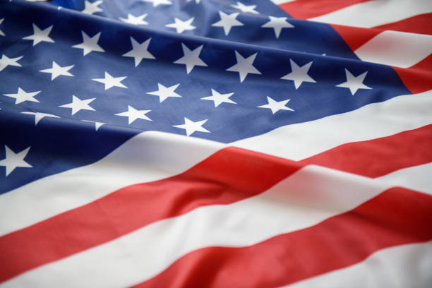 istock US American flag waving as background 1174996296