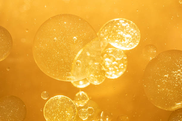 istock golden yellow bubble oil droplet, abstract background 1174996764