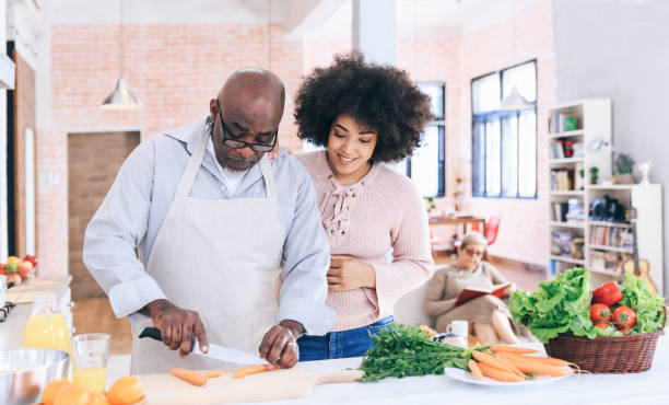 istock Lovely mutli generation family cooking together 1174996893