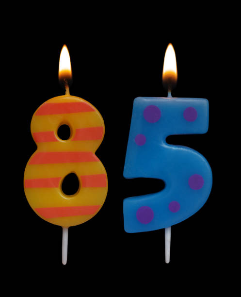 istock Burning birthday candle isolated, number 85 1175001896