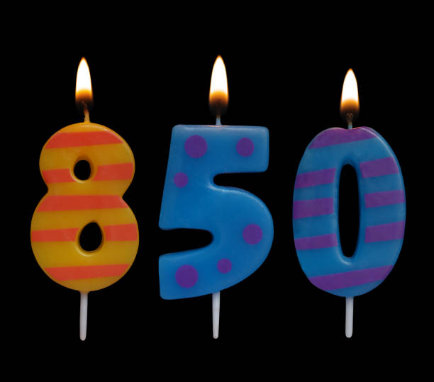 istock Burning birthday candle isolated on black, number 850 1175001971