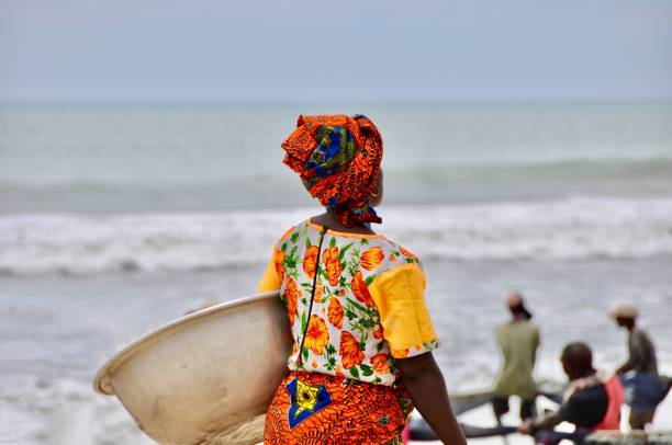 istock Rear View Of Woman With Container Standing On Beach 1175003106
