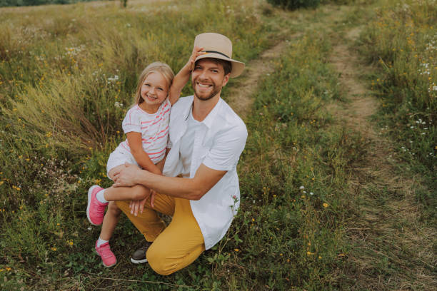 istock Pretty little girl is hugging her father 1175003884