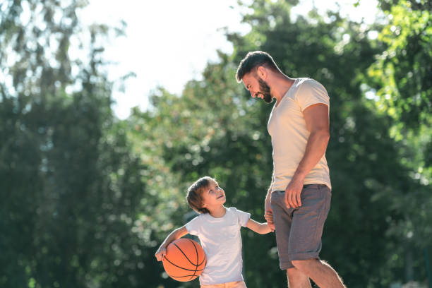 istock Young family with a ball 1175005057