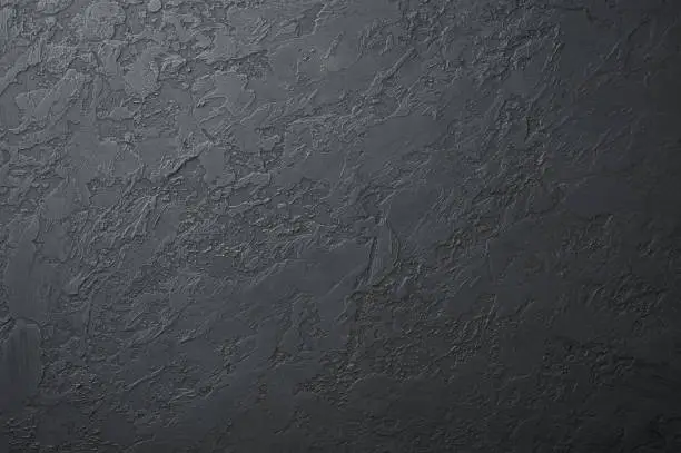 Photo of black concrete background with cracks texture. black slate empty surface with copy space for design