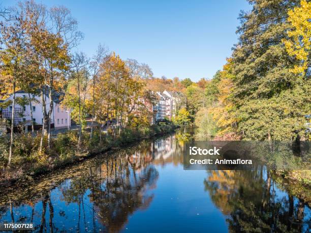 Saale In Germany With Autumnal Reflection Stock Photo - Download Image Now - Architecture, Autumn, Bavaria