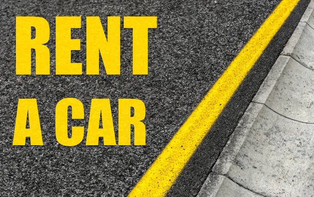 istock Car rental inscription on the road. 1175007995