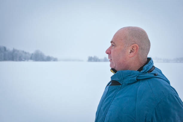 istock Middle Aged Male in Winter Landscape 1175008008