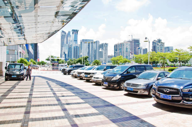Taxicabs and cars at the drop off-pick up spot of JW Marriott Hotel in Futian business district, Shenzhen - China stock photo