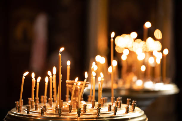 istock Candle Lights Bokeh Background, Candlelight Service. Burning candles 1175010176