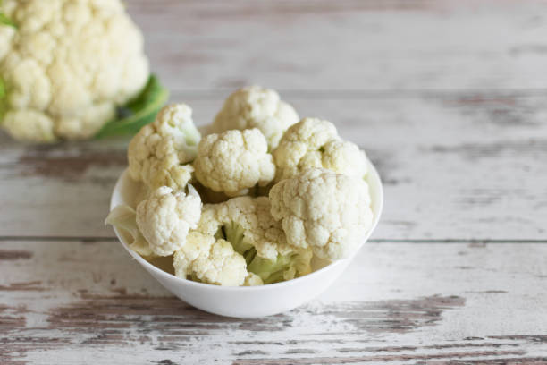 istock Fresh organic cauliflower on wooden background. 1175014881