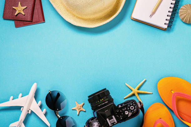 istock Various beach accessories on a blue background with copy space, top view. Vacation and travel concept 1175014920