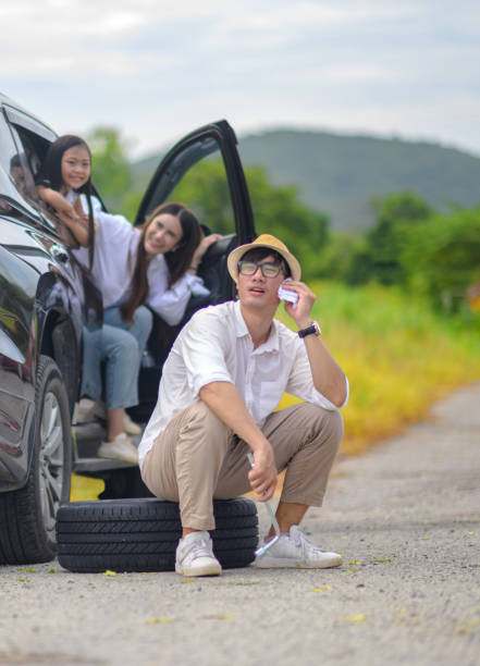 Family 13 happy family in car tire flat during traveling, calls for help beat up car stock pictures, royalty-free photos & images