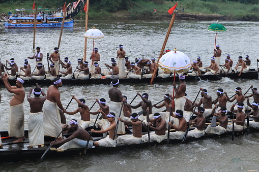 Aranmula, Kerala, India - September 15,2019: Traditionally dressed oarsmen raw snake boats to participate in the boat race  held as part of the Onam celebration in Aranmula, Kerala, India.
