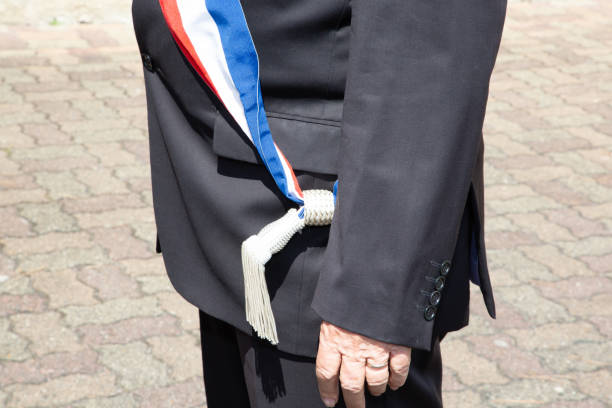 français maire pendant la célébration officielle avec le ruban tricolore d'écharpe - sash white blue red photos et images de collection