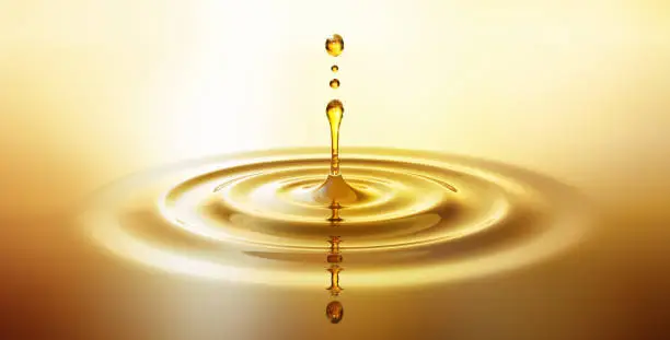 Photo of Moisturizing cosmetic oil drop with ripples