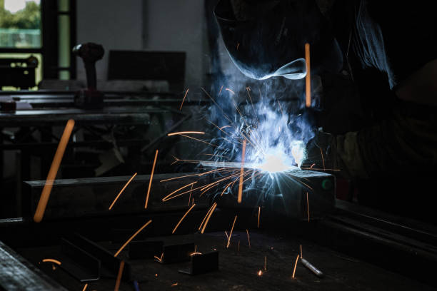 istock Steel worker grinding metal in a workshop. 1175019209