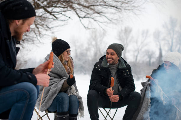 istock Friends having barbecue on a snowy day 1175019387