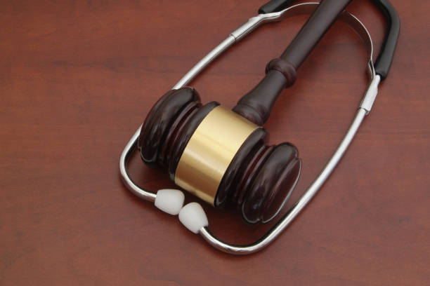 istock Judge gavel and stethoscope on wooden background, malpractice concept 1175019405